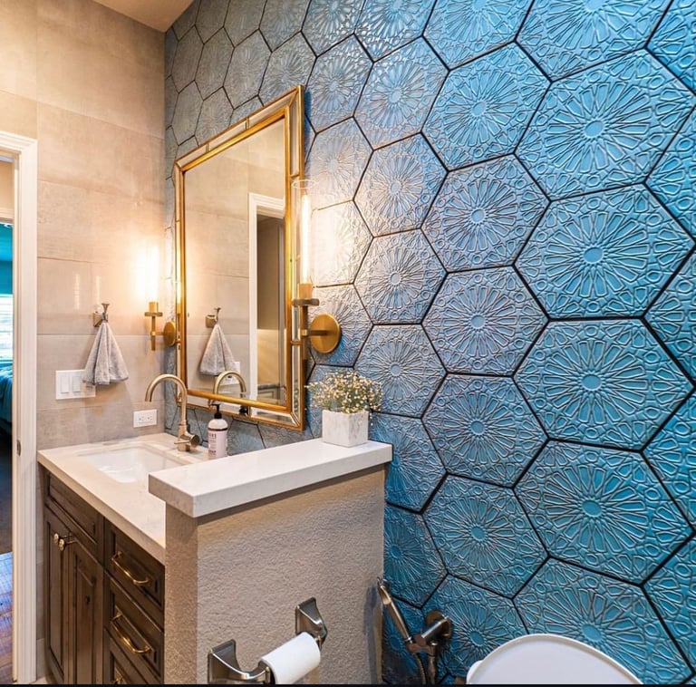 Modern bathroom with gold-framed mirror and blue patterned tile wall accent